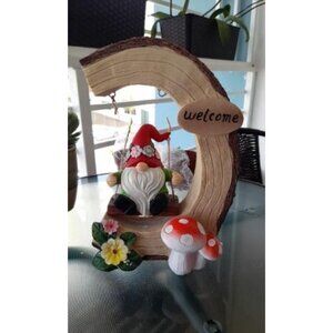 Solar Garden Statue for Outdoor: Gnome Sitting on a Swinging Under Tree Stump